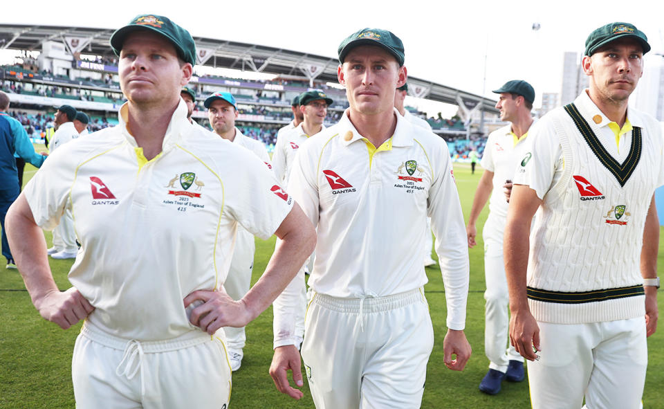 Steve Smith, Marnus Labuschagne and Scott Boland look on.