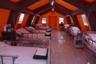 In this photo released by Ukraine's Emergency Situation Ministry on Feb. 20, 2021, a mobile hospital is set up in front of a regional hospital in the Ivano-Frankivsk region, Ukraine. After several delays, Ukraine finally on Tuesday, Feb. 23, 2021, received 500,000 doses of the AstraZeneca vaccine marketed under the name CoviShield, the first shipment of Covid-19 vaccine doses. The country of 40 million is one of the last in the region to begin inoculating its population. (Emergency Situation Ministry via AP)