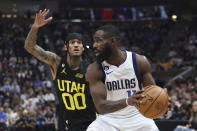 Dallas Mavericks forward Tim Hardaway Jr. (11) look to pass the ball against Utah Jazz guard Jordan Clarkson (00) in the first quarter of an NBA basketball game Saturday, Jan. 28, 2023, in Salt Lake City. (AP Photo/Rob Gray)