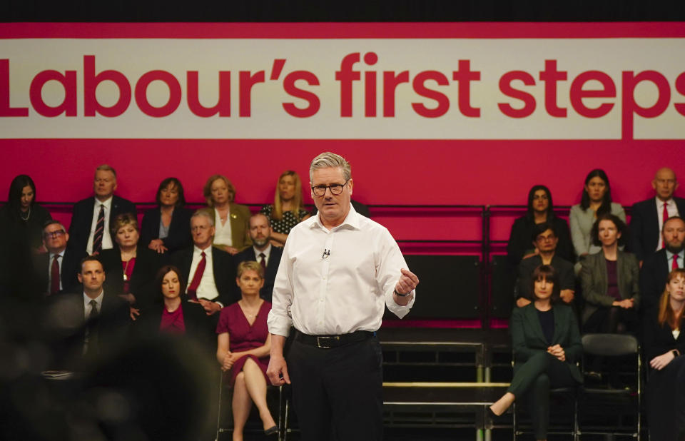 Labour Party leader Sir Keir Starmer speaks during his visit to the Backstage Centre for the launch of Labour's doorstep offer to voters ahead of the general election, in Purfleet, Essex, England, Thursday May 16, 2024. (Victoria Jones/PA via AP)