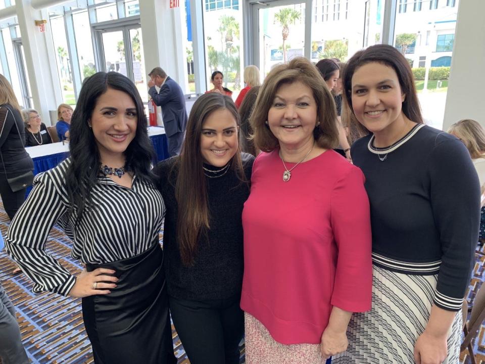 Forough Hosseini, second from right, poses with her three daughters, Nina and Nika and Nellie Lupoli after their Food Brings Hope organization was honored as the Daytona Beach Regional Chamber of Commerce's nonprofit of the year in 2021.