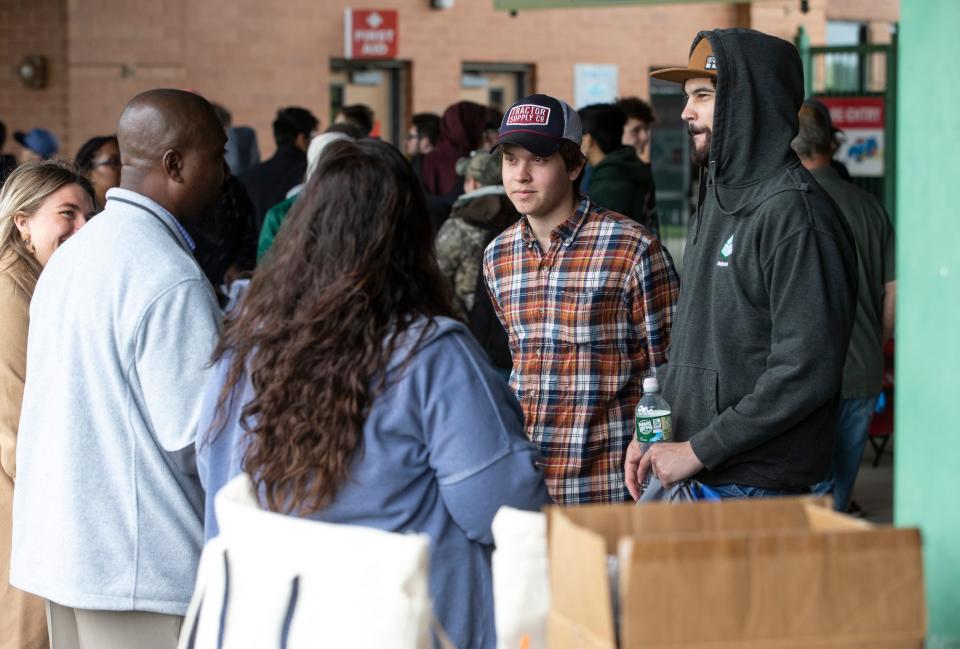 Daniel Gnad of Lacey and Timothy Scates of Manchester talk with representatives of J.F. Keily Construction. Ocean County and state labor departments host a job fair for the construction industry at ShoreTown Ballpark. Students of the Ocean County Vocational Technical Schools were brought in to apply for jobs. Lakewood, NJWednesday, May11, 2022