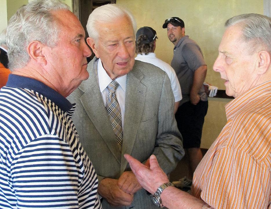 In this April 11, 2014 photo, U.S. Rep. Ralph Hall mingles with fellow military veterans at a weekly "Band of Brothers" happy hour he attends nearly every week in his hometown of Rockwall, Texas. A 90-year-old World War II veteran, Hall is the oldest-ever member of the U.S. House and insists heís campaigning the same way he always does, but faces a potentially tough May 27 Republican primary election in his district east of Dallas. (AP Photo/Will Weissert)