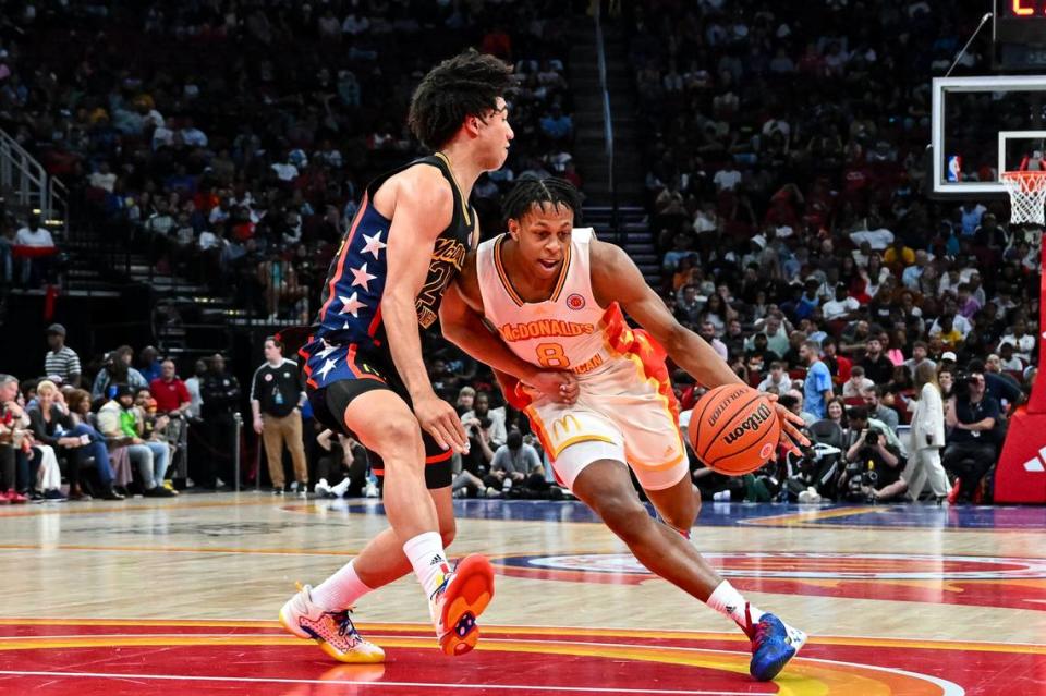 McDonald’s All-American East guard Elmarko Jackson (8) drives to the basket around McDonald’s All-American West guard Jared McCain (24) during the second half at Toyota Center in Houston on March 28, 2023.