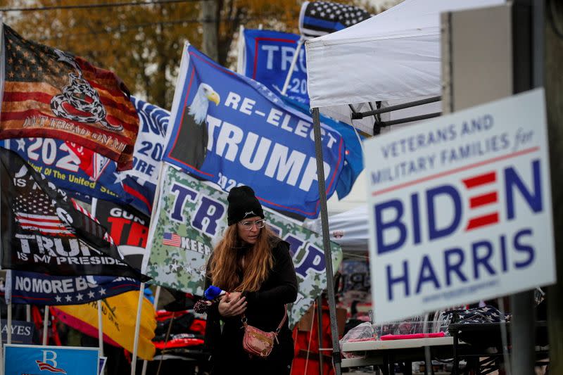 A supporter of U.S. President Trump looks to buy merchandise near his campaign event at Erie International Airport in Pennsylvania