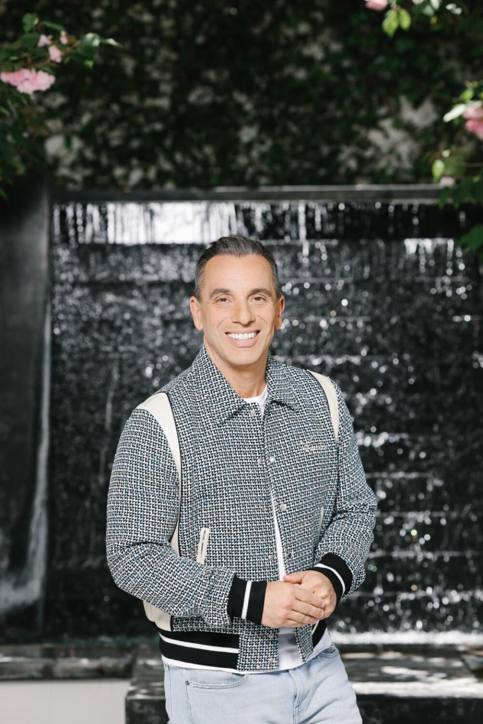 Man standing near a black wall