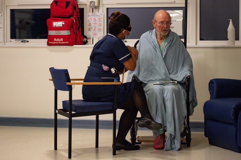 "Bill" William Shakespeare, 81, receives the Pfizer/BioNTech COVID-19 vaccine at University Hospital in Coventry