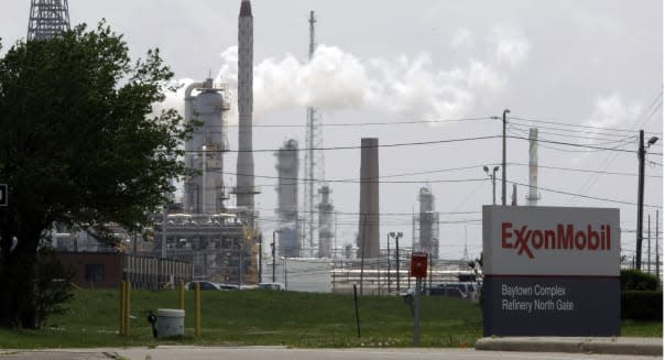Exxon Energy (FILE - In this April 16, 2010 file  photo, steam rises from towers at an Exxon Mobil refinery in Baytown, Texas. E