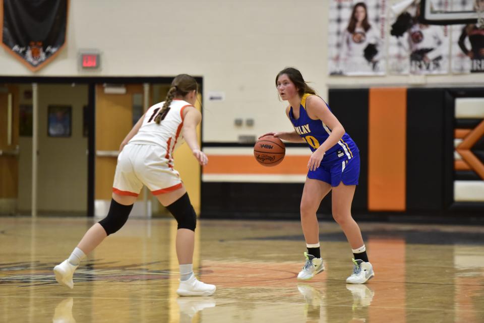 Imlay City's Lily Lengemann looks to set up a play during the Spartans' 66-37 win over Armada at Armada High School on Tuesday.