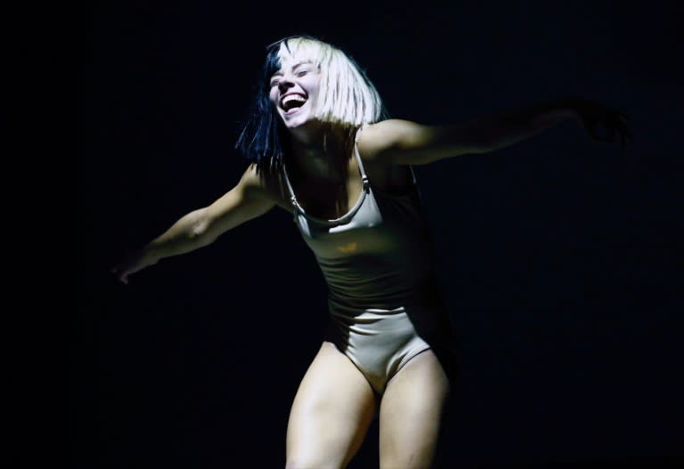 Other acts on Panorama's final day included Sia, pictured on July 24, 2016, a famously camera-shy Australian songwriter who stood in a far corner with a half-platinum, half-black wig covering her face under a giant bow