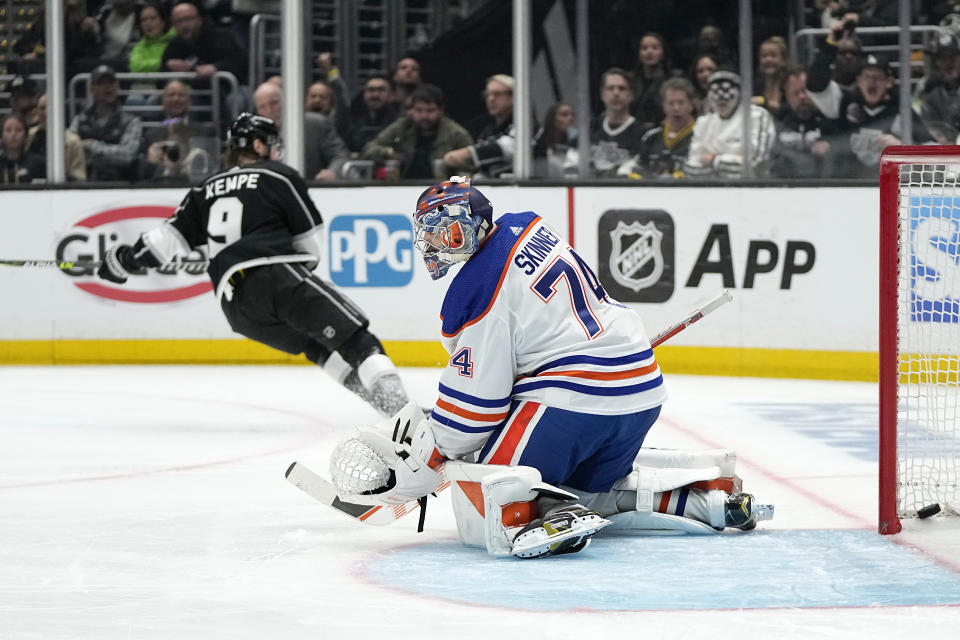 Los Angeles Kings right wing Adrian Kempe, left, skates away after scoring on Edmonton Oilers goaltender Stuart Skinner during the second period in Game 3 of an NHL hockey Stanley Cup first-round playoff series Friday, April 21, 2023, in Los Angeles. (AP Photo/Mark J. Terrill)