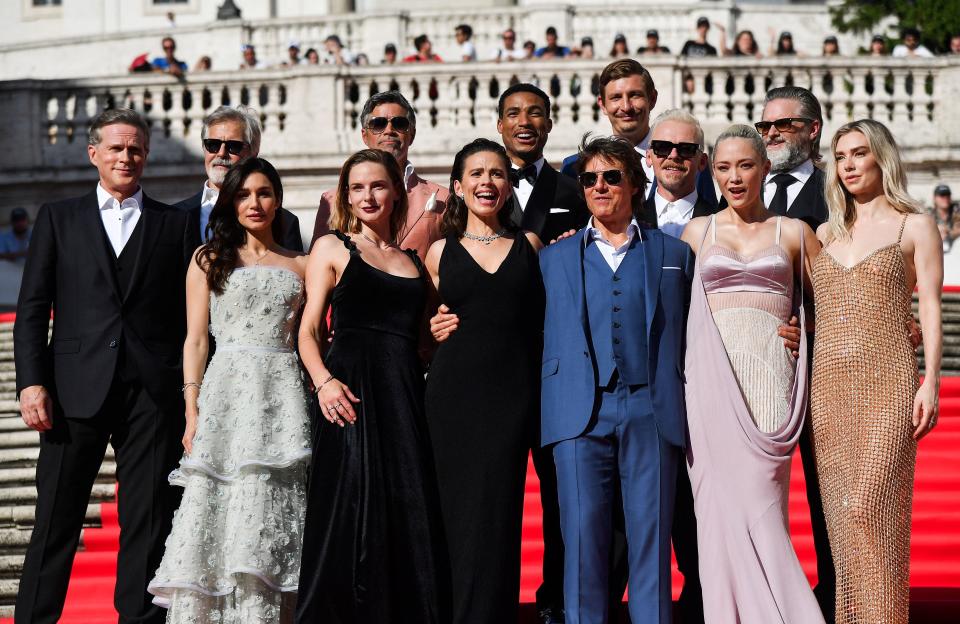 (From L back row) British actor Cary Elwes, Canadian actor Henry Czerny, US actor Esai Morales, US actor Greg Tarzan Davis, British actor Simon Pegg, British actor Frederick Schmidt, US actor Shea Whigham (from L first row) Cuban, Italian and US actress Mariela Garriga, Swedish actress Rebecca Ferguson, British-US actress Hayley Atwell, US film director Christopher McQuarrie, US producer and actor Tom Cruise, French actress Pom Klementieff and British actress Vanessa Kirby pose on the Spanish Steps ahead of the premiere of 