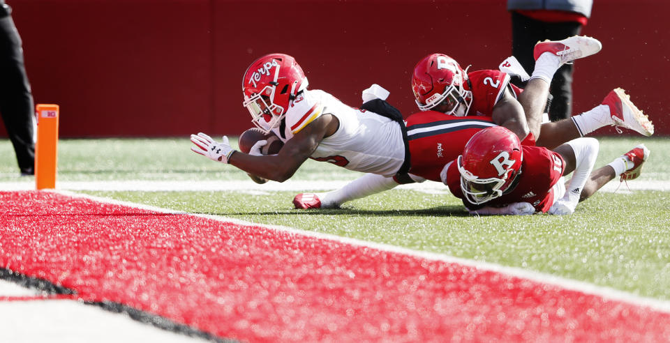 Maryland wide receiver Brian Cobbs (15) scores a touchdown against Rutgers defensive back Avery Young (2) and Rutgers defensive back Max Melton (16) during the first half of an NCAA football game, Saturday, Nov. 27, 2021, in Piscataway, N.J. (AP Photo/Noah K. Murray)