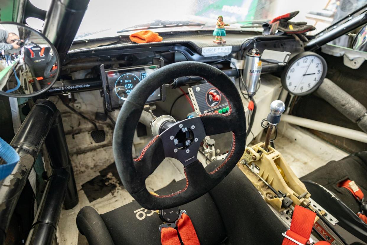 a car with a steering wheel and gauges