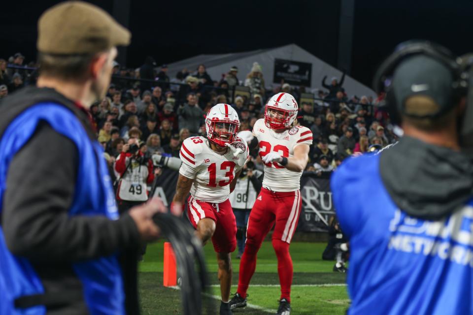 Nebraska Cornhuskers defensive back Malcolm Hartzog (13) celebrates after catching an interception during the NCAA football game against the Purdue Boilermaker, at Ross-Ade Stadium, on Oct. 15, 2022, in West Lafayette, Ind