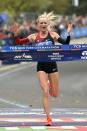 Nov 5, 2017; New York, NY, USA; Shalane Flanagan celebrates as she crosses the finish line to win the professional women's division at the 2017 TCS New York City Marathon. Mandatory Credit: Derik Hamilton-USA TODAY Sports