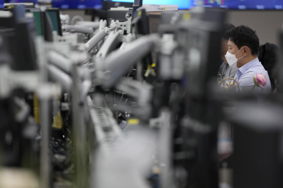 A currency trader watches computer monitors at a foreign exchange dealing room in Seoul, South Korea, Thursday, Oct. 27, 2022. Asian stock markets were mixed Thursday ahead of an update on the U.S. economy and a European Central Bank meeting that is expected to raise its key interest rate to a 13-year high. (AP Photo/Lee Jin-man)