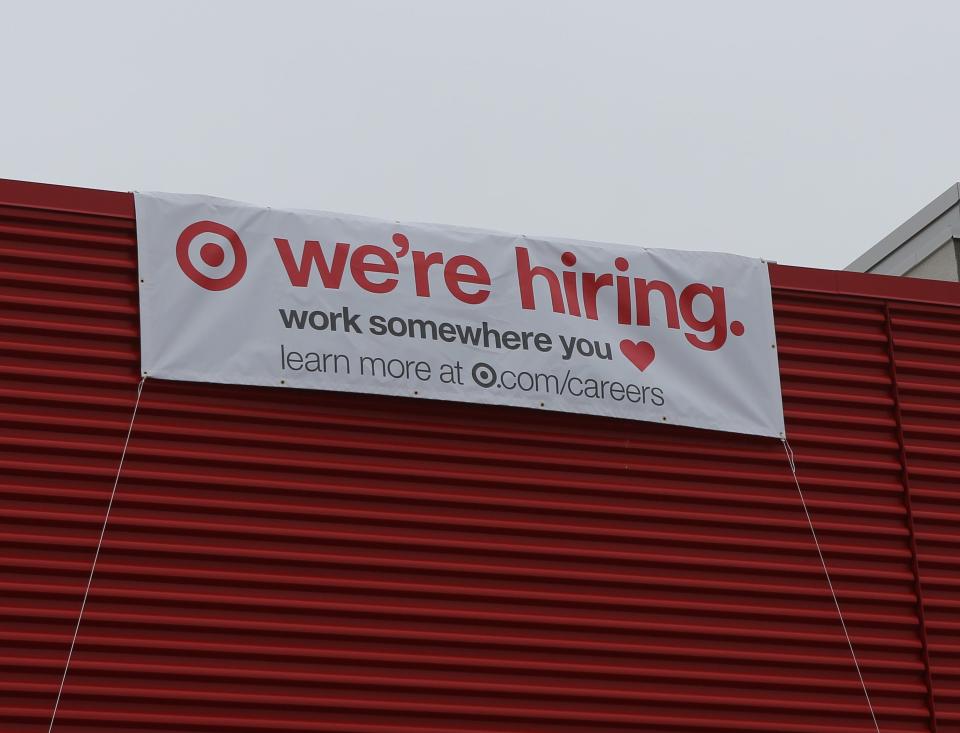 A banner on the side on a new Target location in the Prices Corner Shopping Center advertises that the business is hiring for its grand opening.