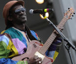 NEW ORLEANS, LA - APRIL 28: Cheikh Lo of senegal performs during the 2012 New Orleans Jazz & Heritage Festival Day 2 at the Fair Grounds Race Course on April 28, 2012 in New Orleans, Louisiana. (Photo by Rick Diamond/Getty Images)