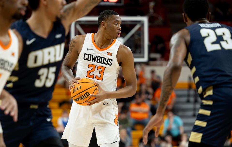 Dec 17, 2023; Stillwater, Okla, USA ; Oklahoma State Cowboys center Brandon Garrison (23) brings the ball up the court in the second half of an NCAA basketball game against the Oral Roberts Golden Eagles at Gallagher Iba arena. Mandatory Credit: Mitch Alcala-The Oklahoman