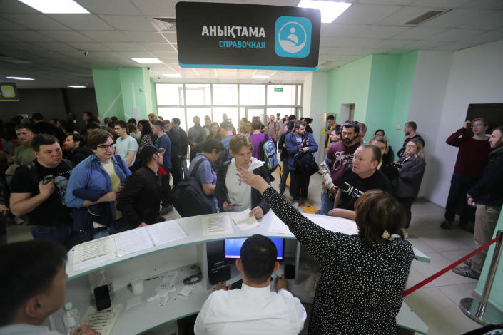 Several dozen Russian citizens inside a public service center in Kazakhstan.