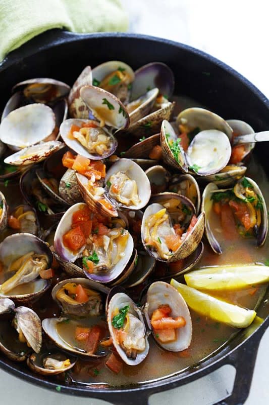 <p>Skillet sauteed clams with garlic, tomatoes, white wine and parsley. This recipe tastes just like restaurants straight from Italy!</p><p><strong>Get the recipe: <a href="https://rasamalaysia.com/italian-sauteed-clams/" rel="nofollow noopener" target="_blank" data-ylk="slk:Italian Sauteed Clams;elm:context_link;itc:0;sec:content-canvas" class="link rapid-noclick-resp">Italian Sauteed Clams</a></strong></p><p><strong>Related: <a href="https://parade.com/1065480/felicialim/best-clam-recipes/" rel="nofollow noopener" target="_blank" data-ylk="slk:31 Seriously Good Clam Recipes;elm:context_link;itc:0;sec:content-canvas" class="link rapid-noclick-resp">31 Seriously Good Clam Recipes</a></strong></p>