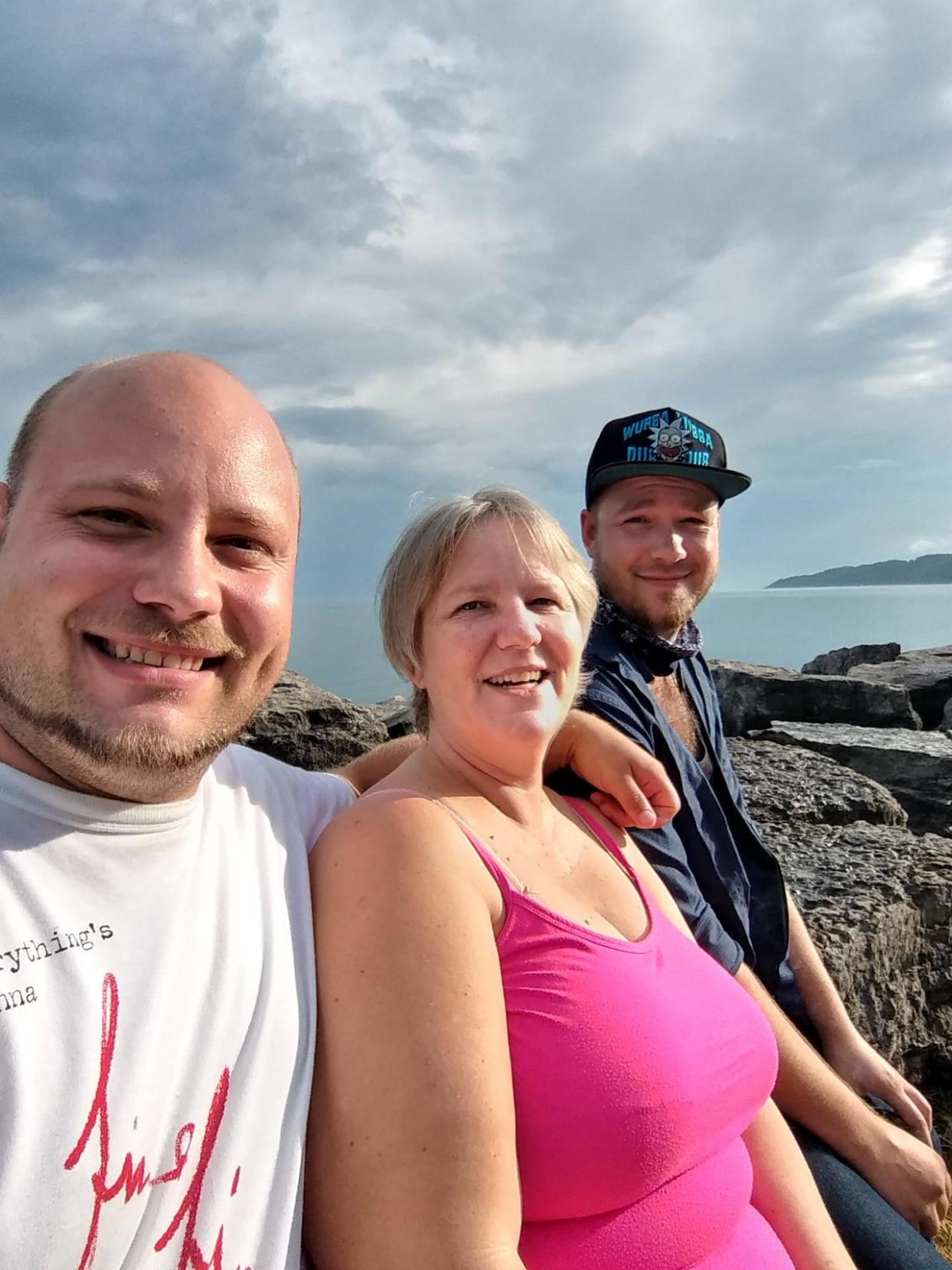 Gabriele Schart, centre, was killed in Mexico on Saturday, say her sons, Corin, right, and Michael, left. They're working to get answers from authorities in Mexico and  prepare a funeral in Zipolite, where their mother lived for the last decade.  (Supplied by Raquel Shulman - image credit)
