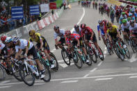 Race leader Primoz Roglic, centre, rides with the pack in the Spanish capital during the La Vuelta cycling race in Madrid, Spain, Sunday, Sept. 15, 2019. (AP Photo/Manu Fernandez)