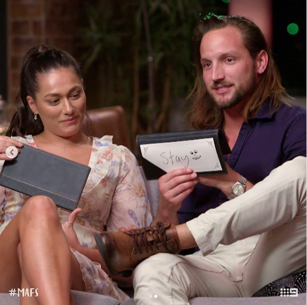 Married At First Sight's Jonethen and Connie on the couch during the show
