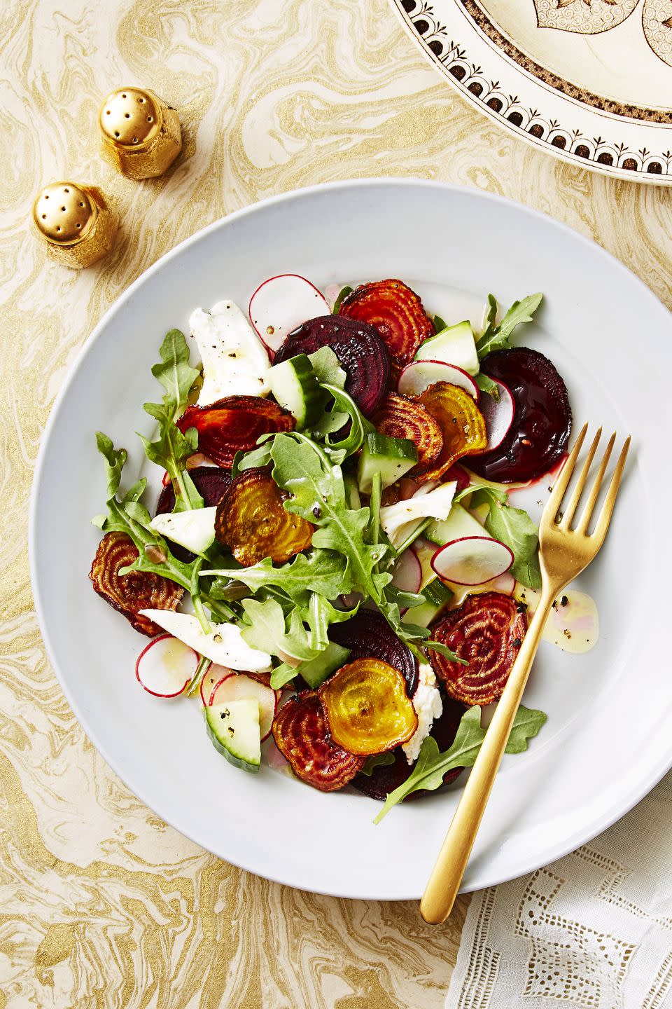 crispy beet and mozzarella salad on a white plate