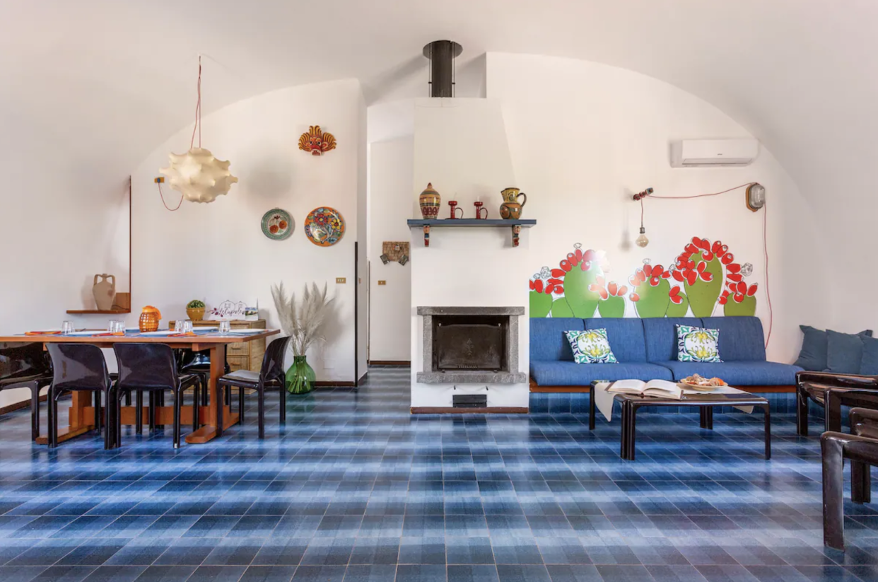 Le Cupole Interior: fireplace mantle and blue tile floor