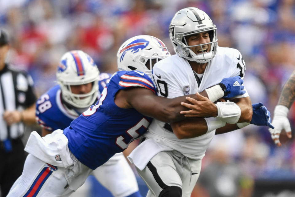 Buffalo Bills defensive end Greg Rousseau (50) tackles Las Vegas Raiders quarterback Jimmy Garoppolo (10) during the first half of an NFL football game, Sunday, Sept. 17, 2023, in Orchard Park, N.Y. (AP Photo/Adrian Kraus)