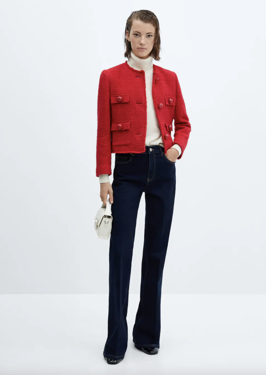 model wearing dark jeans, white turtleneck and red Pocket Tweed Jacket (Photo via Mango)