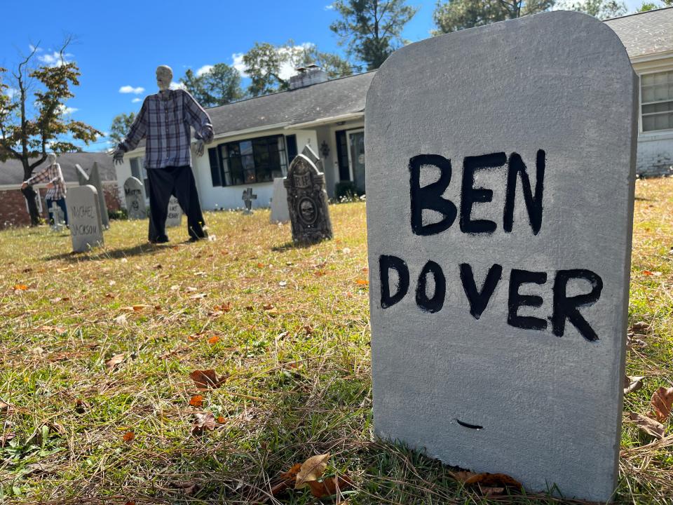 A comedic, homemade gravestone sits outside the Mercer house on Camelot Drive on Tuesday, Oct. 17, 2023.