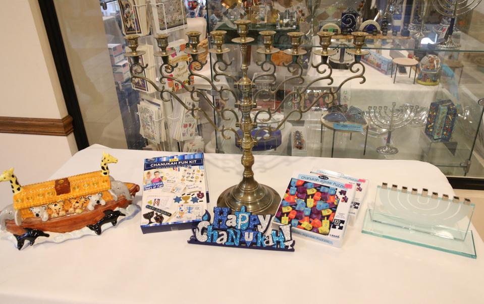 These items, like traditional and modern versions of the menorah and other related items, are there for the celebration of Hanukkah at Sinai Synagogue in South Bend.