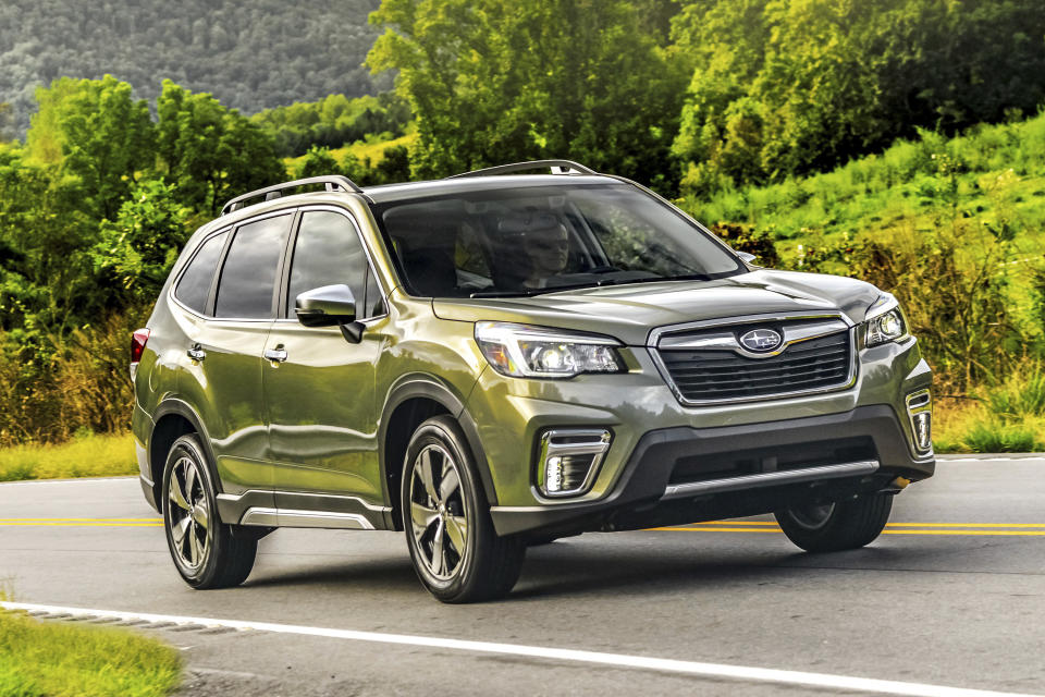 This undated photo provided by Subaru shows the Subaru Forester, one of Edmunds' favorite midsize SUVs. It's spacious and comfortable. And it's rated to carry rooftop tents that weigh as much as 176 pounds while in motion or tents loaded with gear (and people) that weigh as much as 700 pounds when it's parked. (Subaru of America via AP)