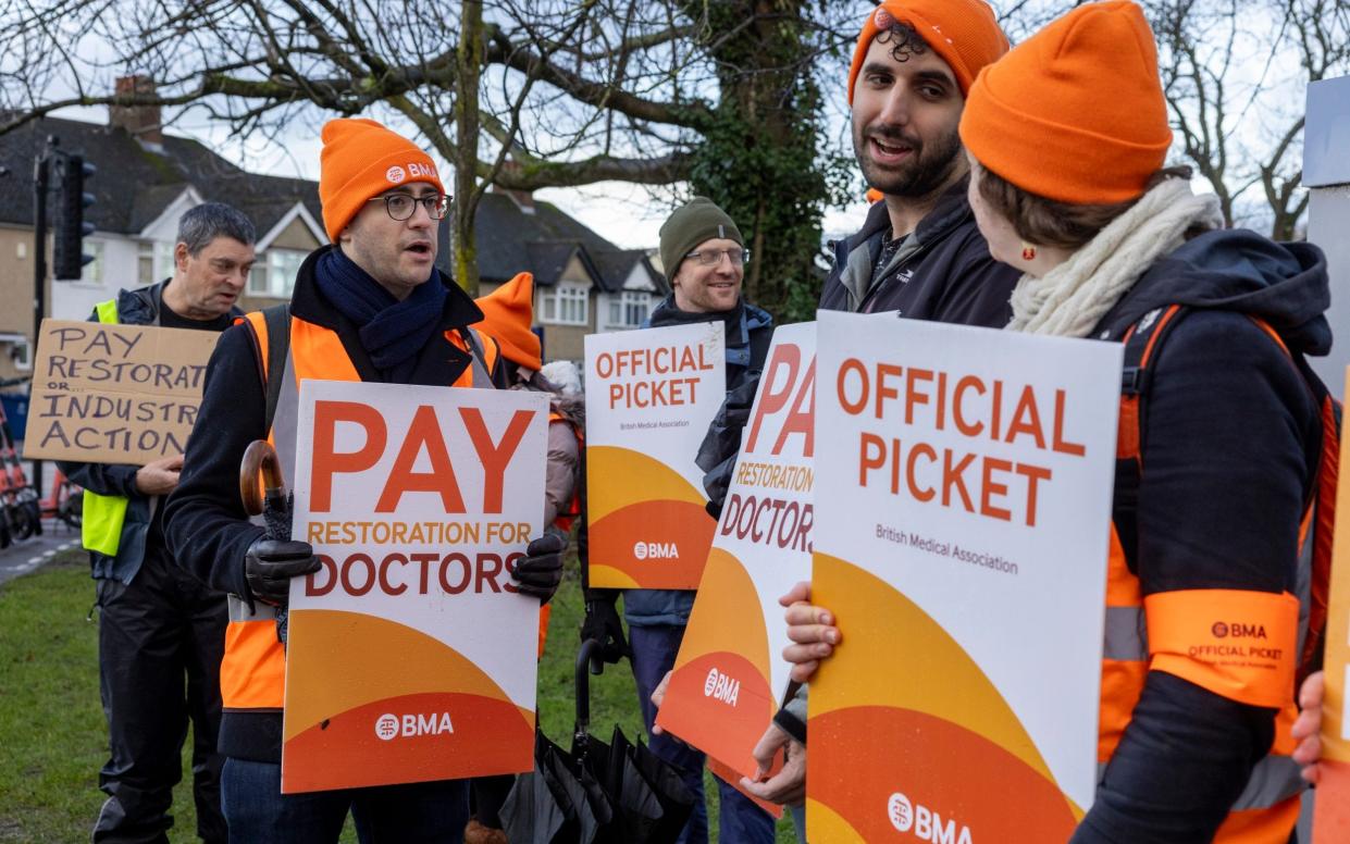 Striking junior doctors in orange hats