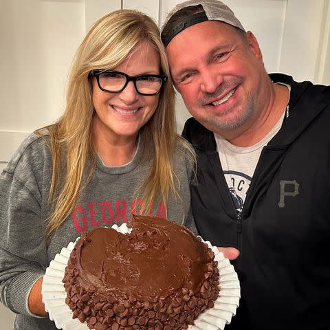 <p>Garth Brooks/Instagram</p> Brooks baked Yearwood a cake for her 59th birthday