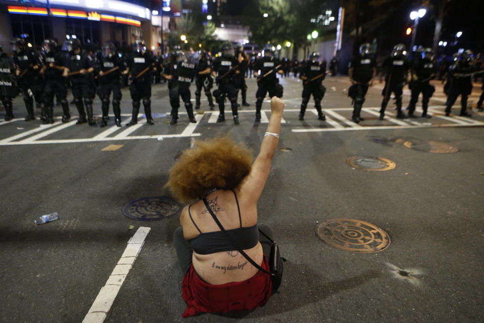 Police clash with demonstrators&nbsp;as residents and activists protest the police shooting death of Keith Scott.