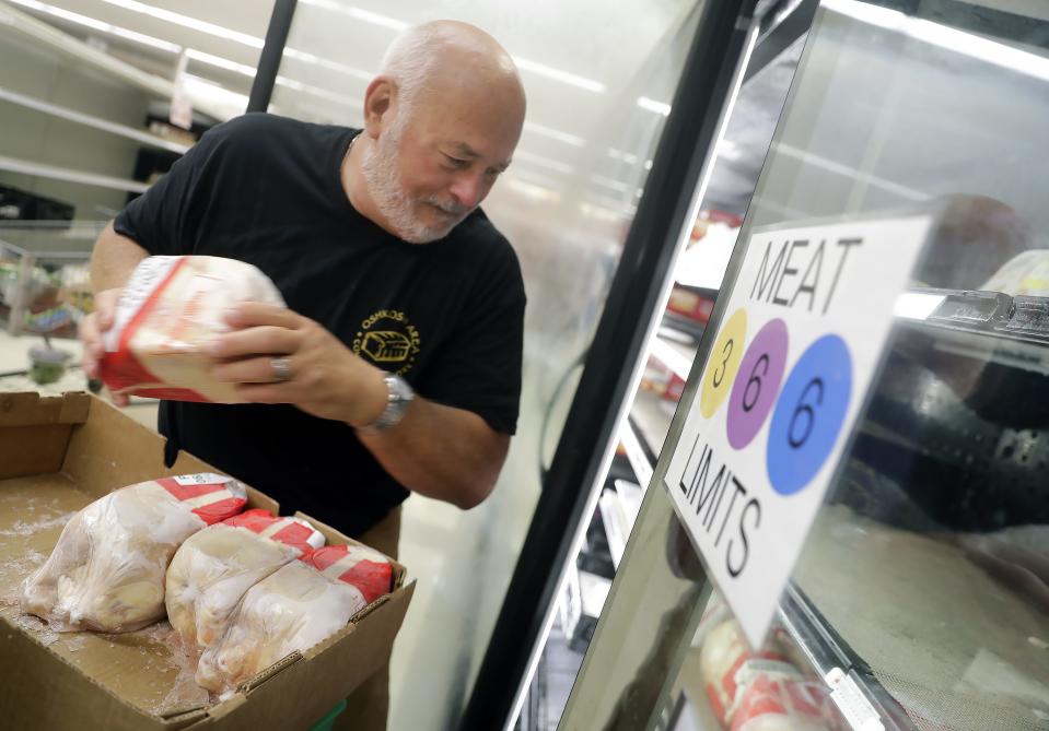 Volunteer Jim Stahl stocks a freezer at the Oshkosh Area Community Pantry 2551 Jackson Street Tuesday, September 26, 2023, in Oshkosh, Wis. 
Wm. Glasheen USA TODAY NETWORK-Wisconsin
