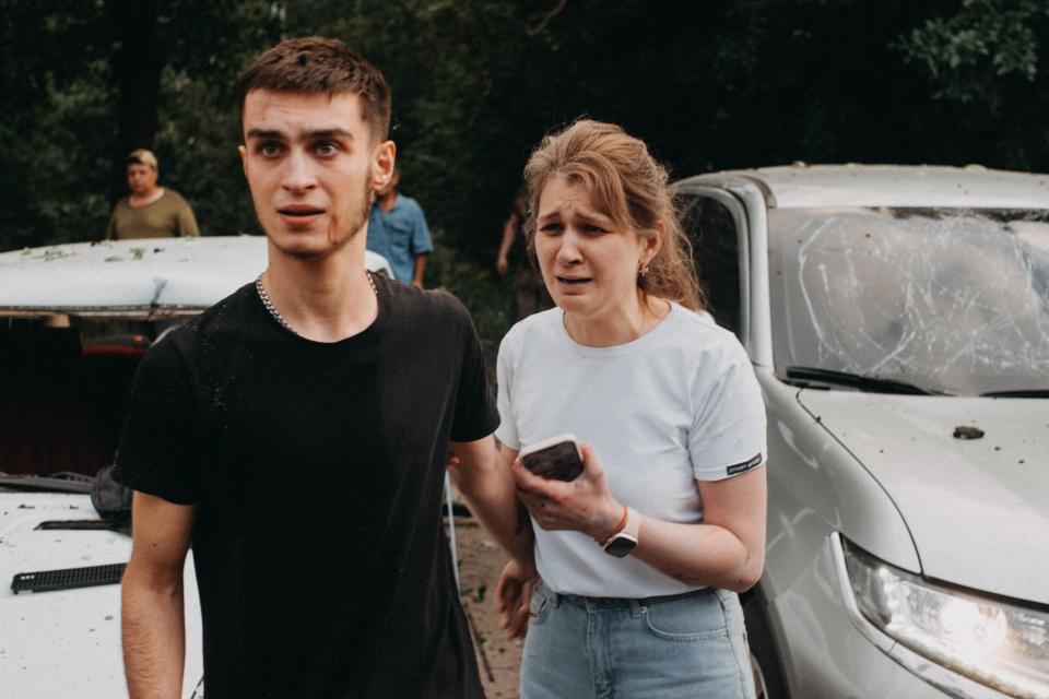 Wounded people are seen as search and rescue efforts continue after a Russian missile attack hits Ria restaurant in Kramatorsk (Anadolu Agency via Getty Images)