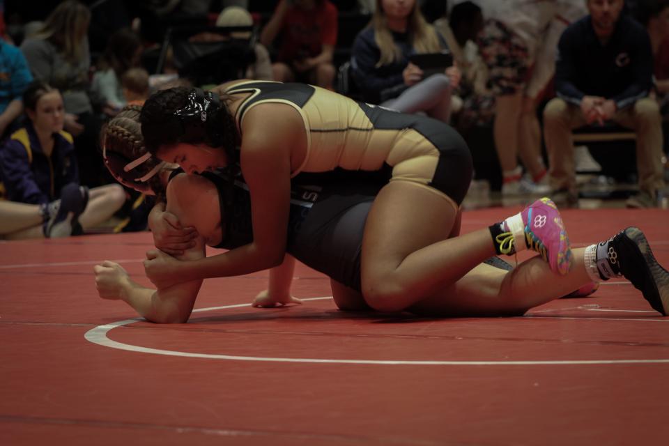 Topeka High senior Marilena Zuniga has been a part of the girls wrestling team since it began in 2019. Zuniga made history last year as one of the team's first state placers.