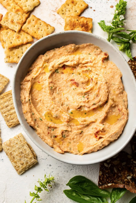 <p>Salt and Lavender</p><p>This sun-dried tomato and basil white bean dip is silky, healthy, and full of flavor. It's ready in under 10 minutes!</p><p><strong>Get the recipe: <a href="https://www.saltandlavender.com/sun-dried-tomato-and-basil-white-bean-dip/" rel="nofollow noopener" target="_blank" data-ylk="slk:Sun Dried Tomato and Basil White Bean Dip;elm:context_link;itc:0;sec:content-canvas" class="link "><em>Sun Dried Tomato and Basil White Bean Dip</em></a></strong></p>