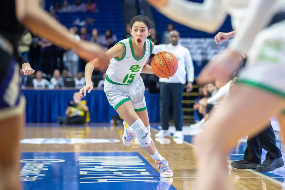 Owensboro Catholic’s Aubrey Randolph (15) contributed six points, five rebounds and two assists and made two key free throws in the closing seconds to help seal the Aces’ victory.