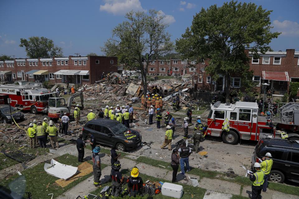 The aftermath of an explosion in Baltimore on Monday, Aug. 10, 2020. Baltimore firefighters say an explosion has levelled several homes in the city. (AP Photo/Julio Cortez)