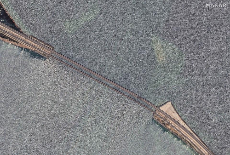 This image provided by Maxar Technologies, shows damaged parts of an automobile link of the Crimean Bridge connecting Russian mainland and Crimean peninsula over the Kerch Strait not far from Kerch, Crimea on Monday, July 17, 2023. (Satellite image ©2023 Maxar Technologies via AP)