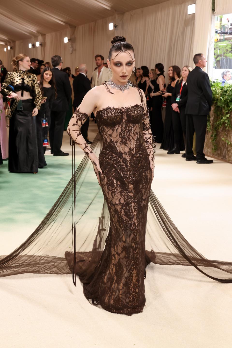 The returning host donned a Jean Paul Gaultier gown meant to represent the fragility and darkness of nature, like a garden in winter.
