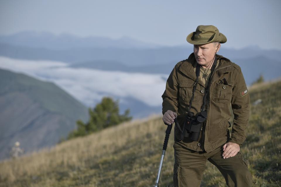 In this photo taken on Sunday, Aug. 26, 2018 and released by Kremlin press service on Monday, Aug. 27, 2018, Russian President Vladimir Putin rests during a mini-break in the Siberian Tyva region, Russia. Putin may look like a winner after an abrupt U.S. decision to pull out of Syria, but the Russian leader faces massive challenges in Syria and elsewhere, and he hasn't moved an inch closer to the lifting of Western sanctions that have emaciated the national economy. (Alexei Nikolsky/Sputnik, Kremlin Pool Photo via AP, File)