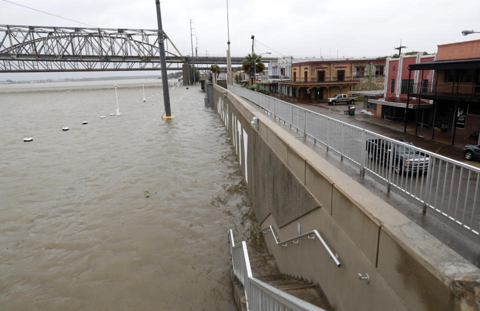 As the Atchafalaya River continues to rise due to the rains of Tropical Storm Barry, it becomes harder to see the Morgan City name on the sea wall, Saturday, July 13, 2019, in Morgan City, La. (AP Photo/Rogelio V. Solis)