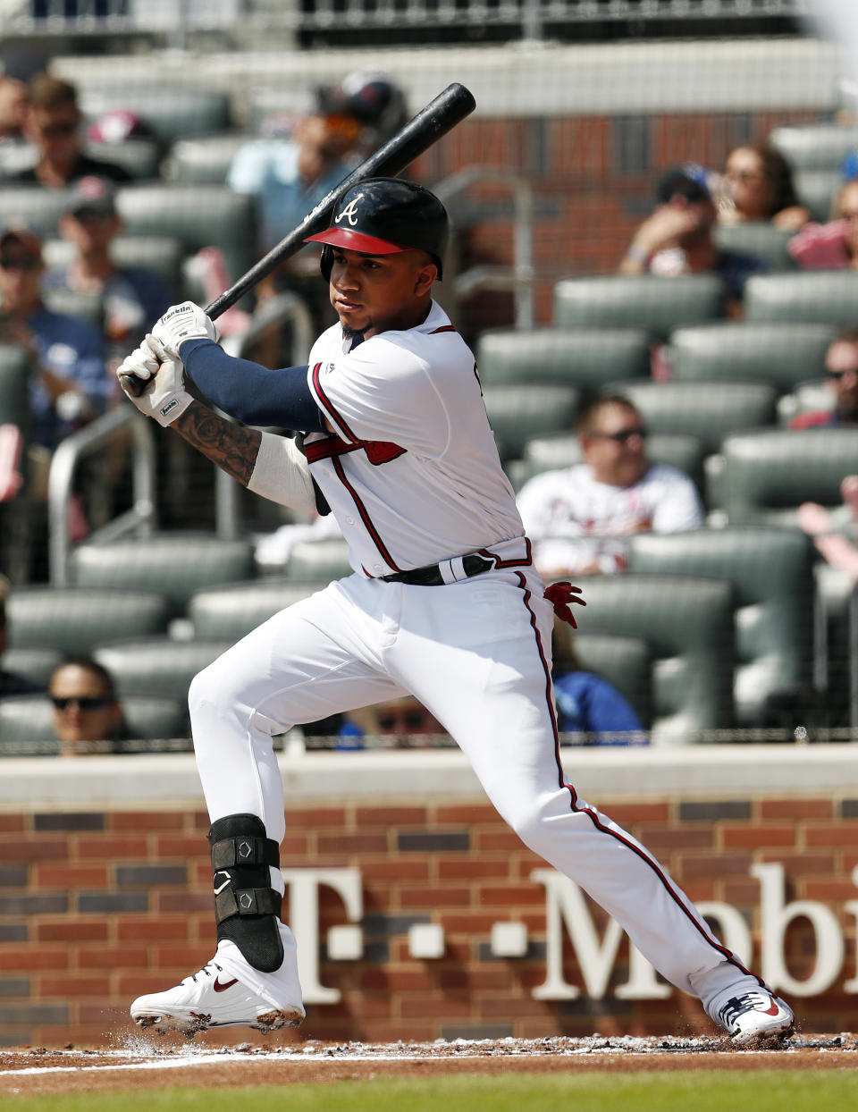 Atlanta Braves' Johan Camargo follows through on a two-run single in the first inning of a baseball game against the Philadelphia Phillies, Saturday, Sept. 22, 2018, in Atlanta. (AP Photo/John Bazemore)